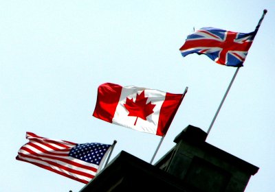 American, Canadian and British Flags fly over the Walper Hotel, Kitchener, Ontario